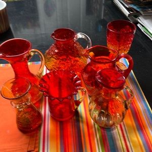 Small red and Orange vintage vases and little pitchers.